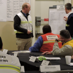 instructors discussing ics training methods before a class