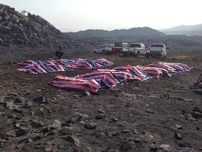 covered caskets of fallen yarnell hill firefighters