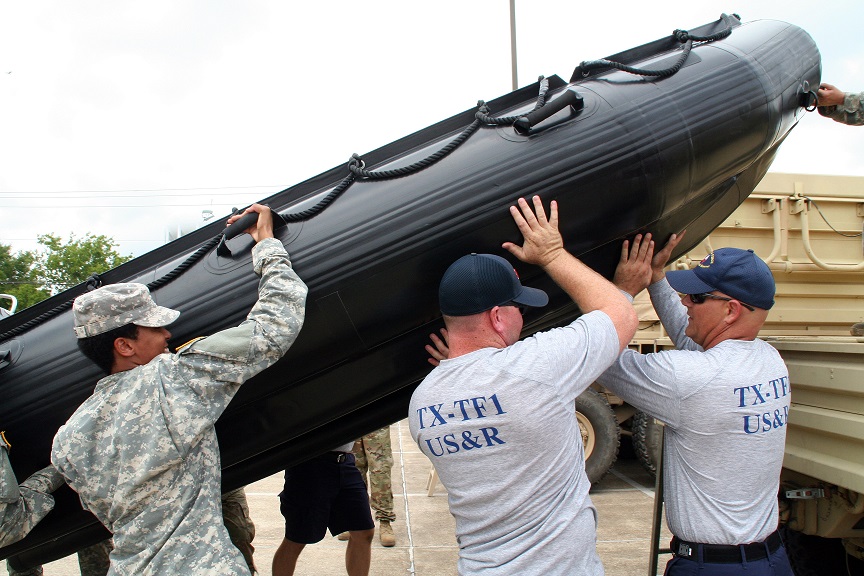 Texas Army National Guard Soldiers joined members of a Texas Task Force Ones Swift Water Rescue Team for<br /> interoperability training leading up to Hurricane Harvey, in Bryan, August 25, 2017.<br /> 700 members of the Texas Army National Guard are being mobilized as part of Hurricane Harvey response operations.<br /> (U.S. Army Photo by Sgt. Steve Johnson/Released)